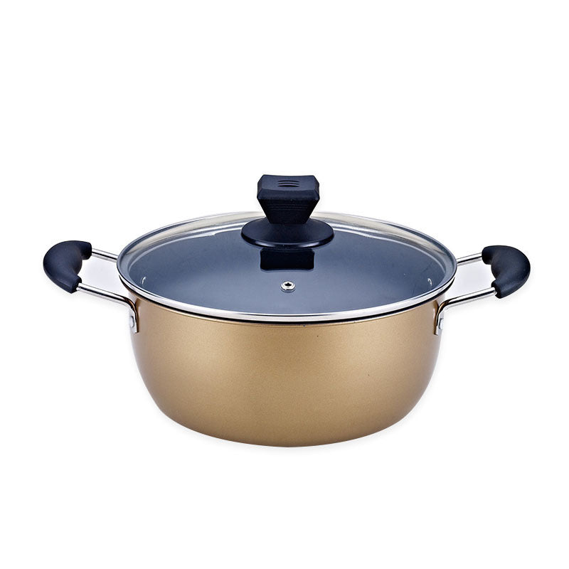 Close-up of large gold stockpot with dual side handles and secure glass lid on white