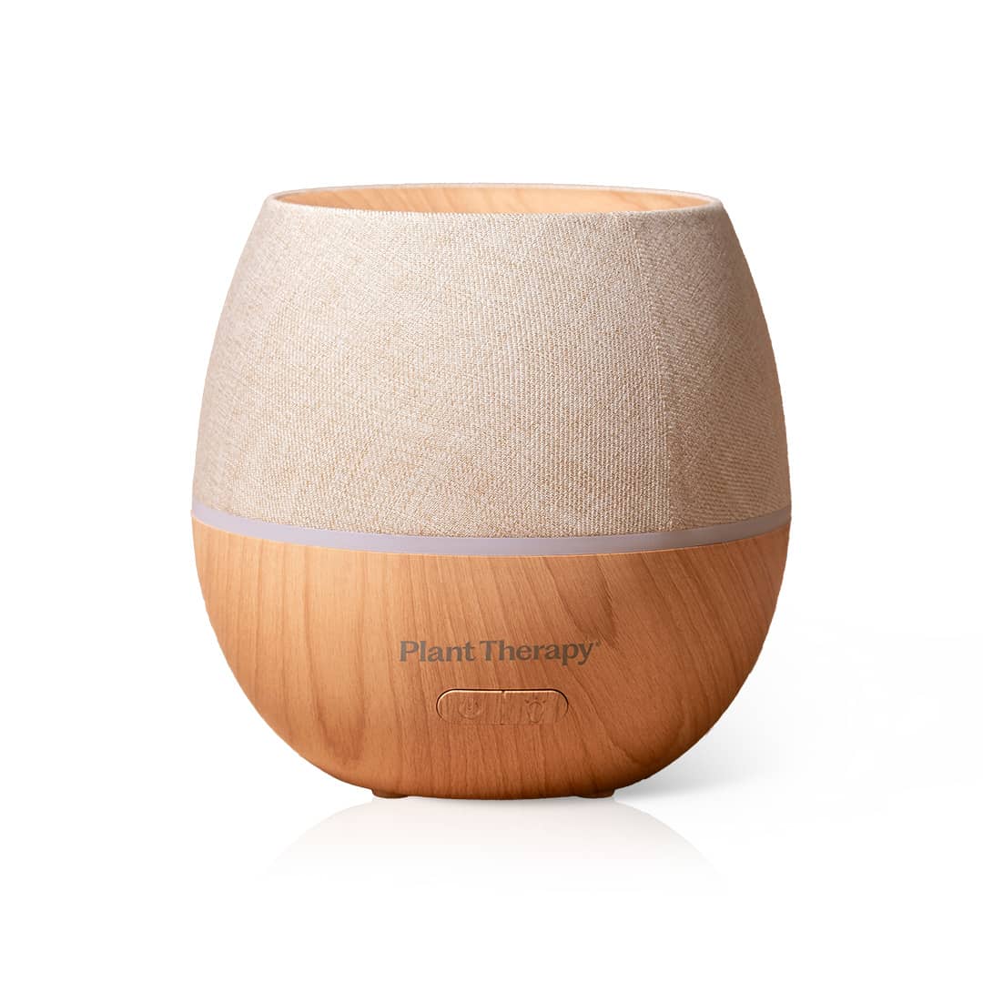 Beige linen-textured and wood-grain base diffuser with control buttons on white background