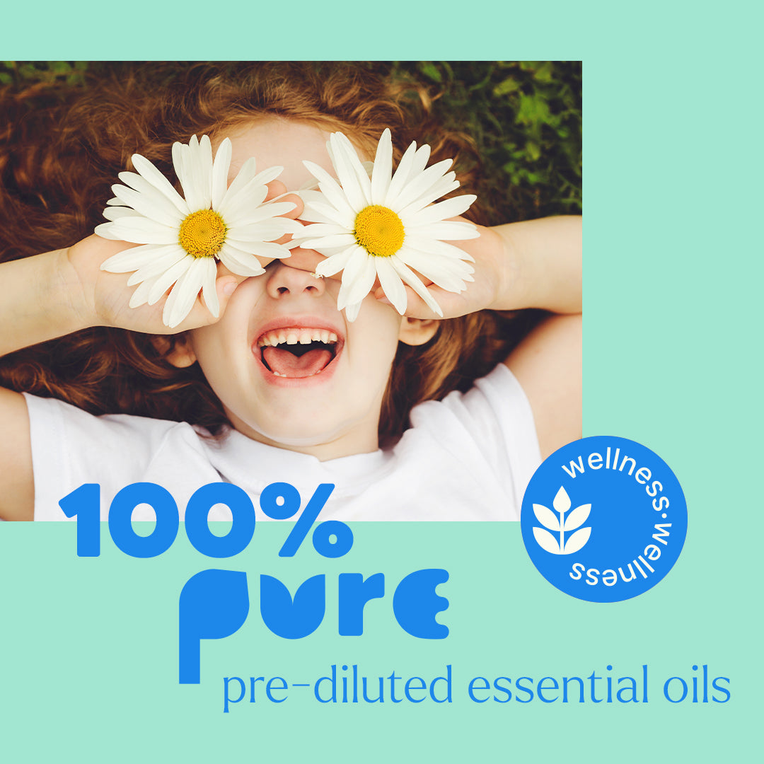Promotional image of a child lying in grass holding daisies over eyes with text overlay about pure oils.