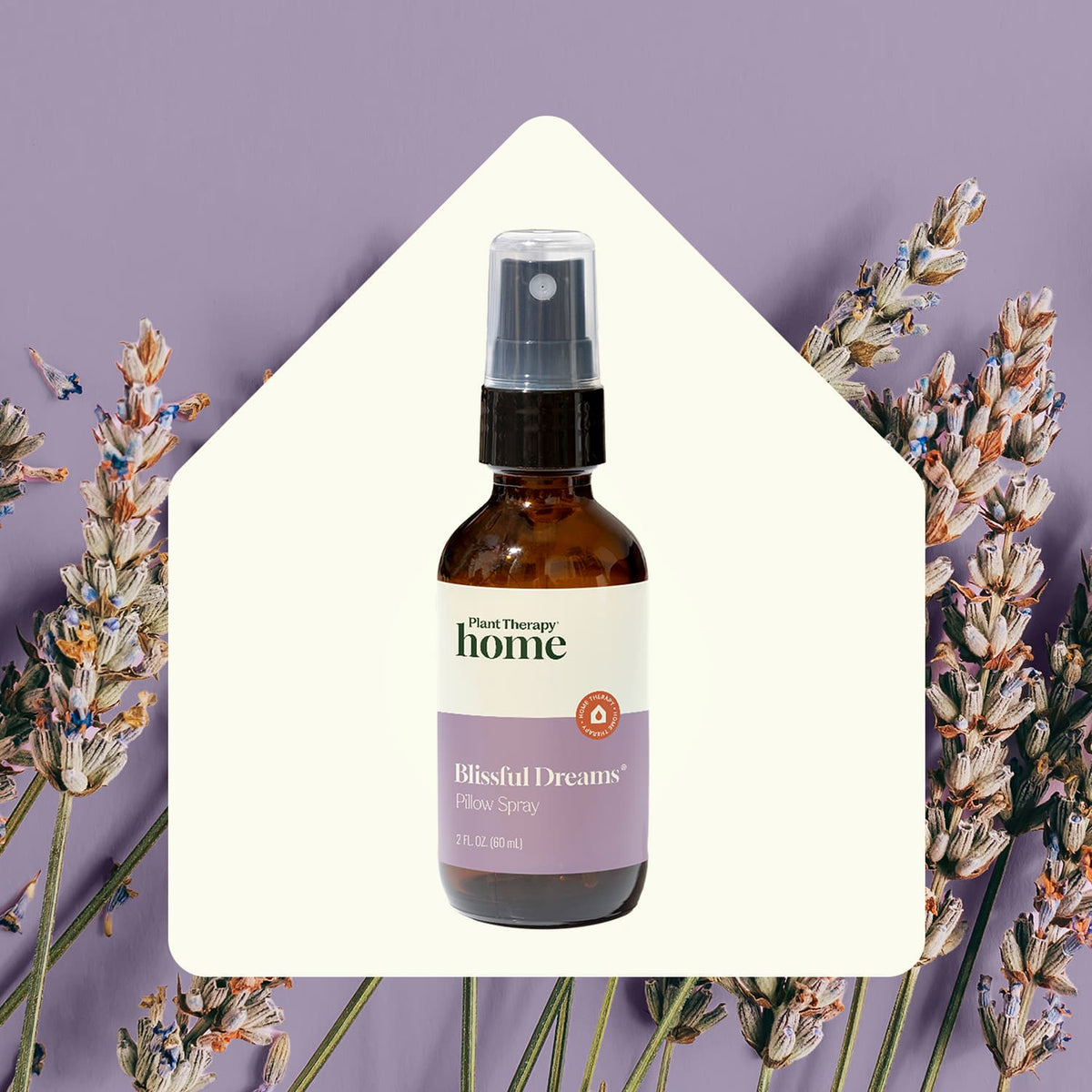 Pillow spray bottle inside white house cutout surrounded by dried lavender