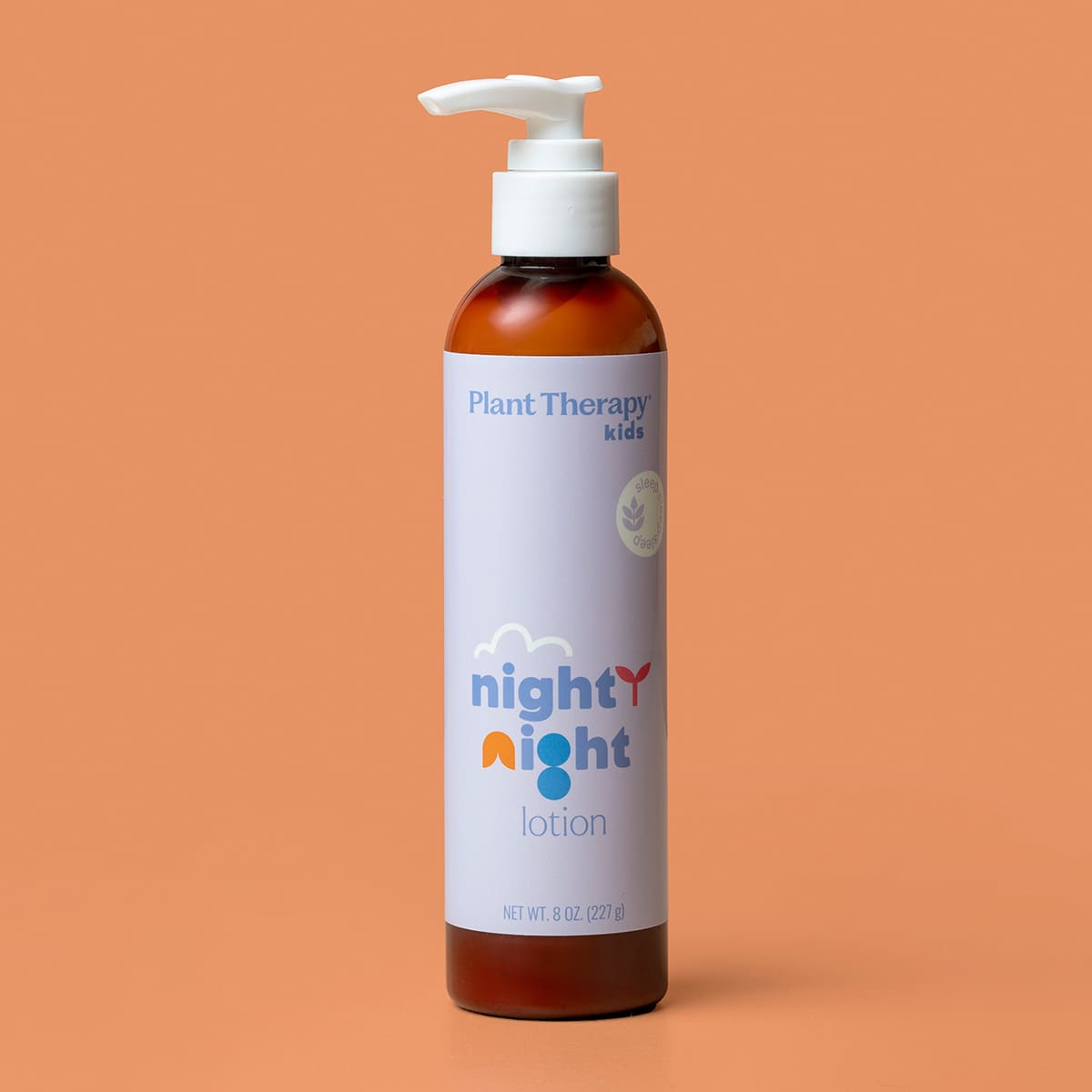 Amber cylindrical bottle with purple label and cloud logo on solid orange background