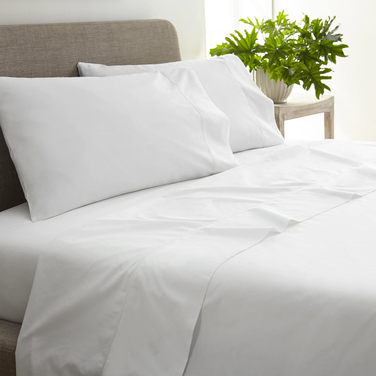 Close-up of white 270 TC percale weave and picot embroidery detail on pillowcases
