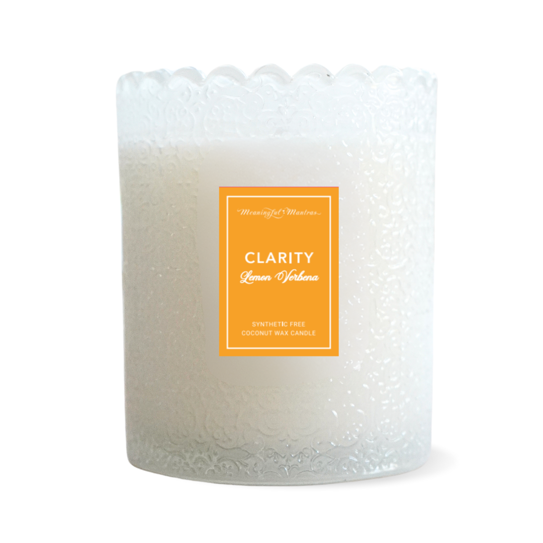 Close-up of textured frosted jar with scalloped edge and orange Clarity Lemon Verbena label