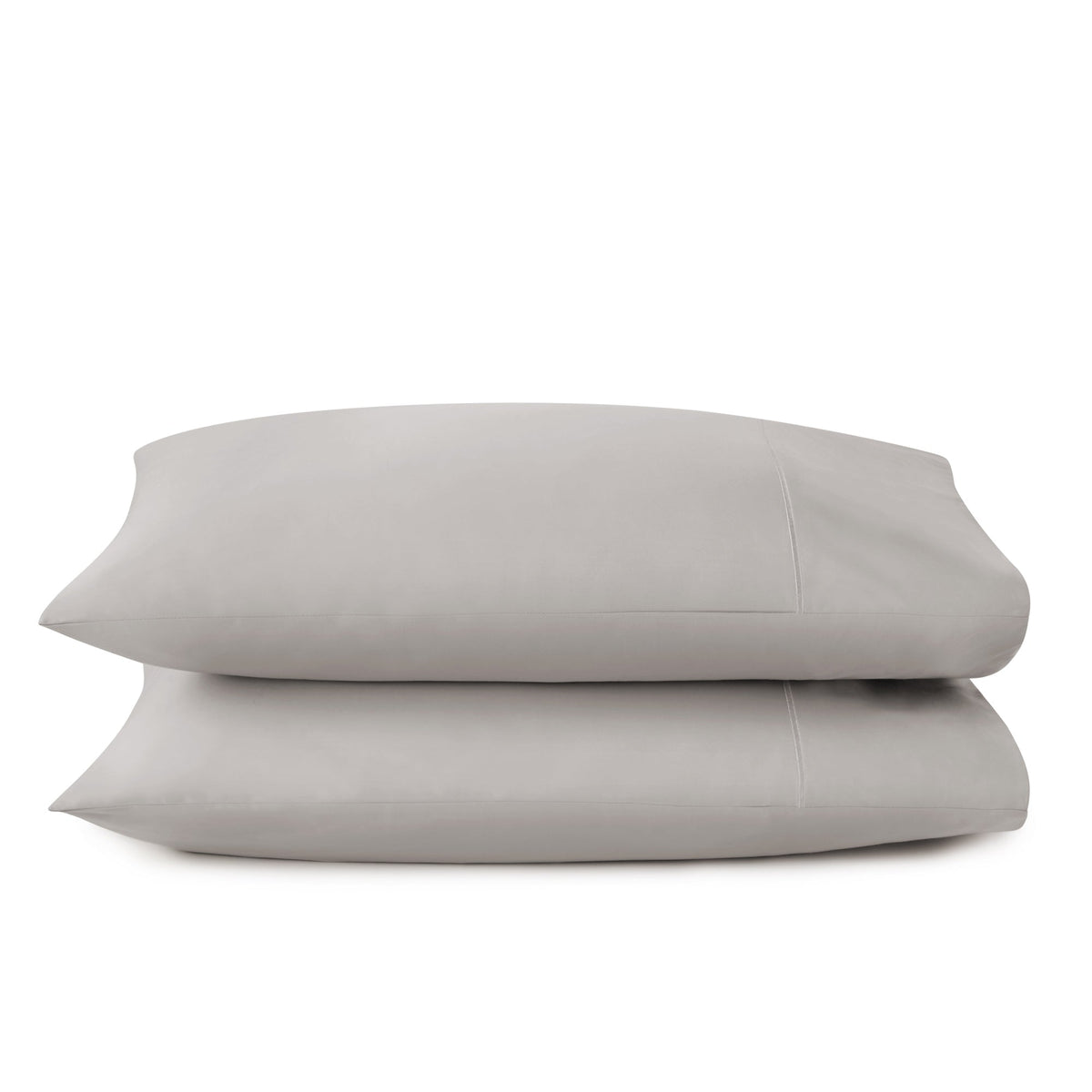 Grey GOTS-certified organic cotton sateen pillowcases highlighting breathable texture and shadowing