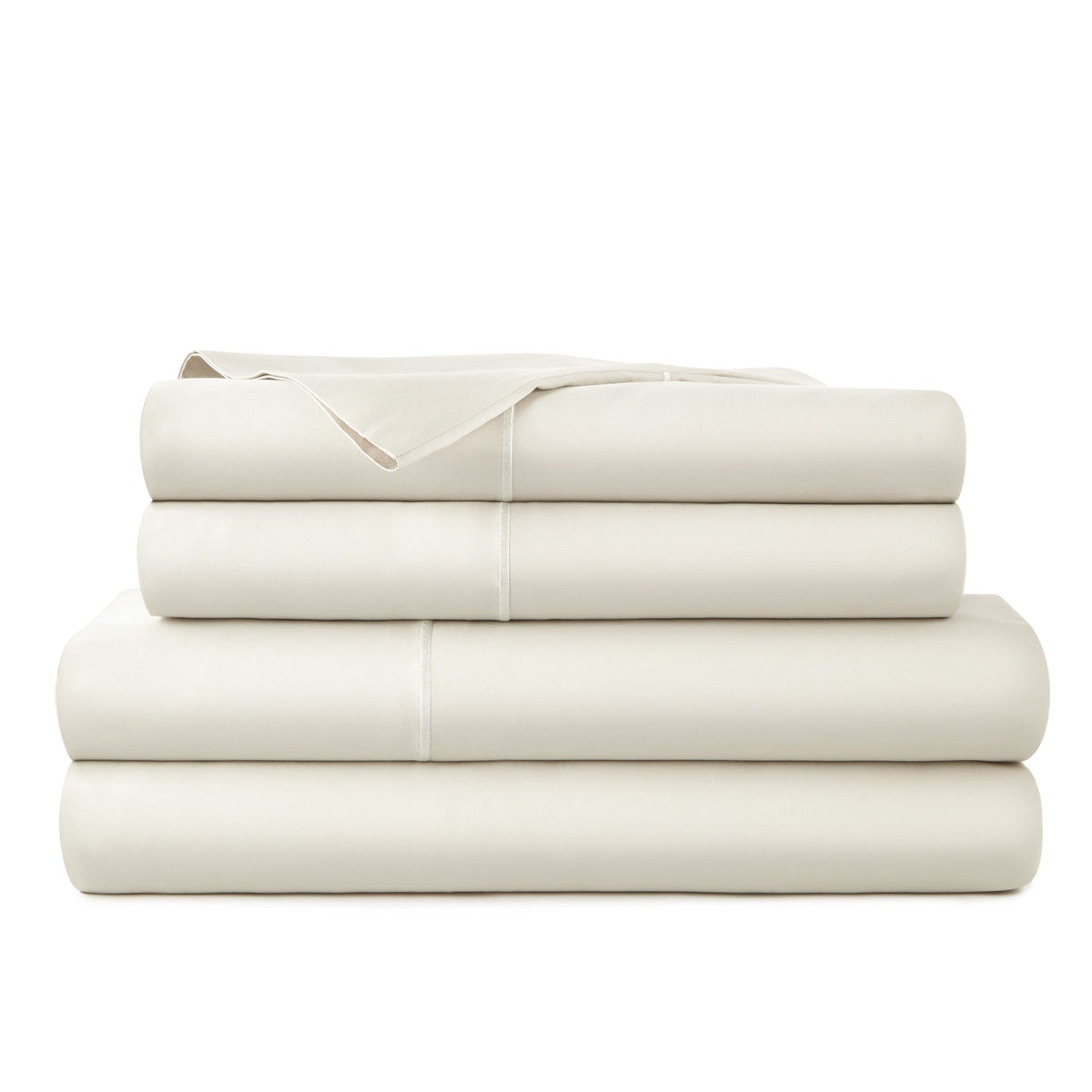 Uniform stack of cream-colored sheets highlighting hypoallergenic organic cotton material with refined edge stitching