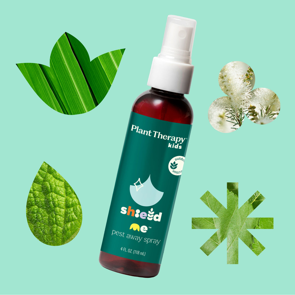 Amber spray bottle surrounded by green leaves and white flowers on mint background emphasizing natural look