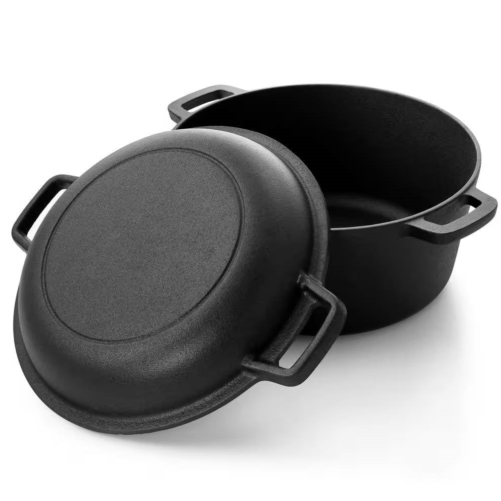 Black cast iron Dutch oven pot beside its inverted lid showing square helper handles