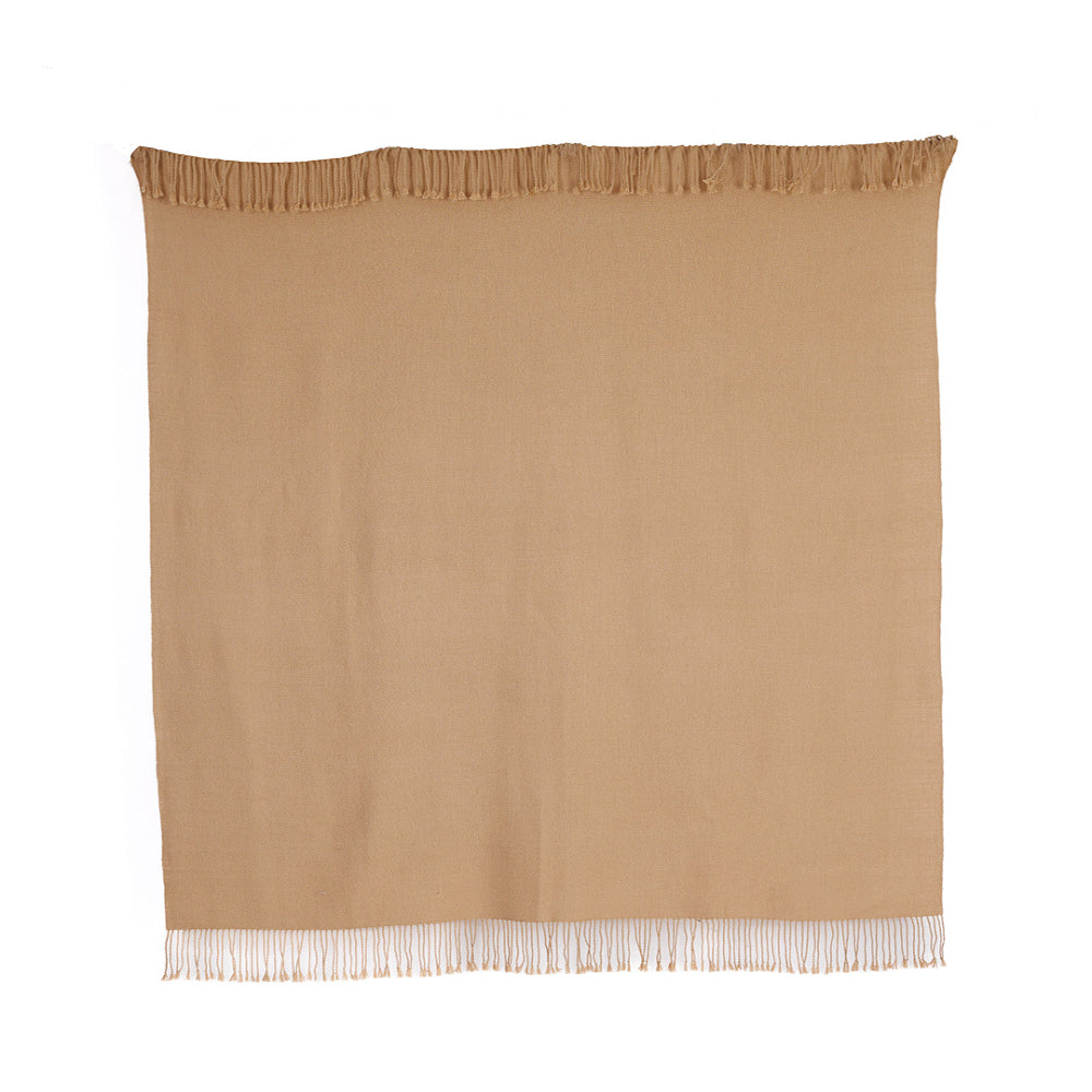 Rectangular rich brown baby alpaca blanket spread flat on white background showing natural camel hue and delicate edges