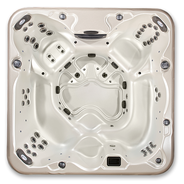 Top-down view of beige hot tub interior showing dual captain chairs, open footwell, black hydrotherapy jets, and control