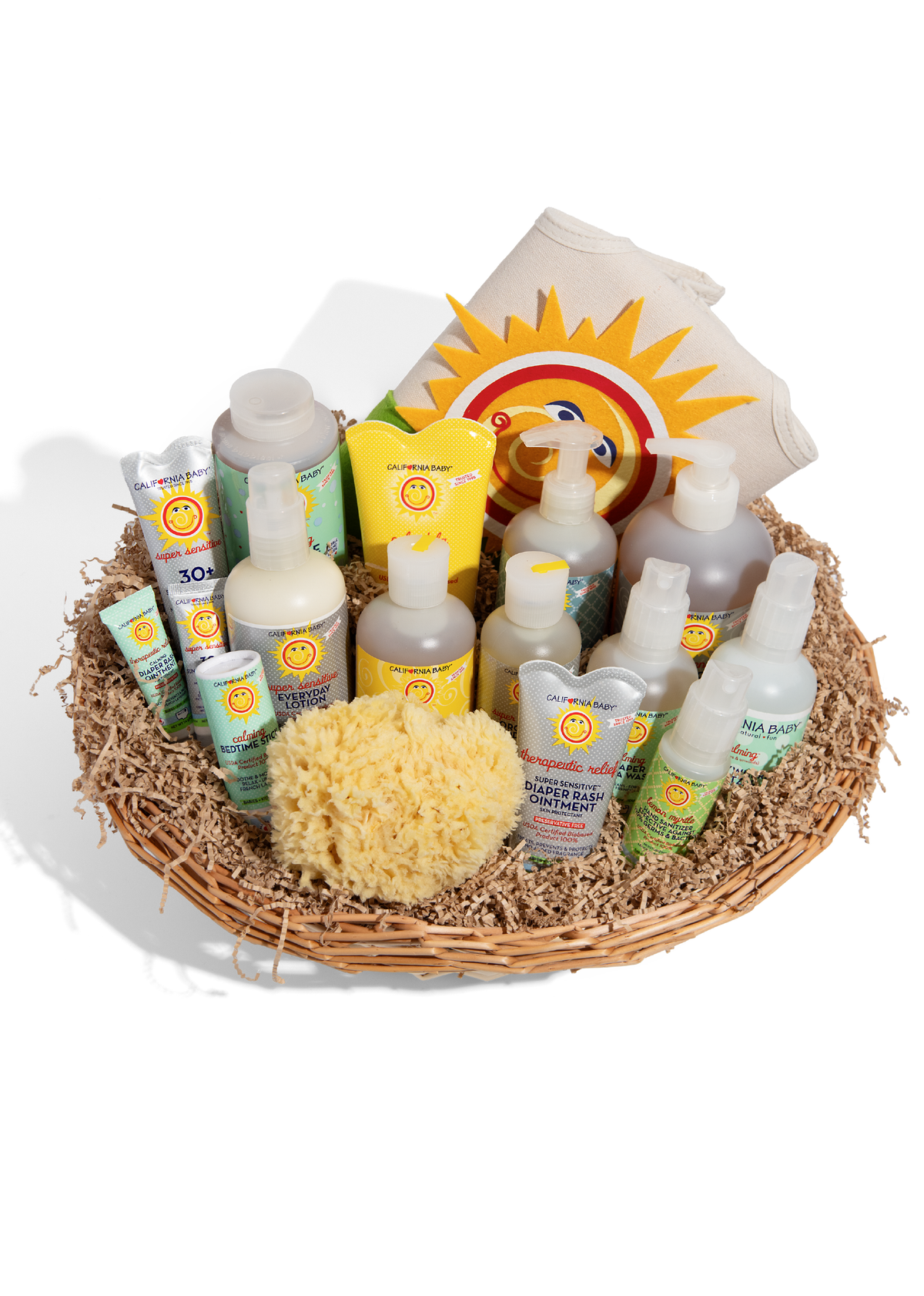 Overhead close-up of baby hygiene items like diaper rash ointment and lotion packed in crinkle paper with sponge