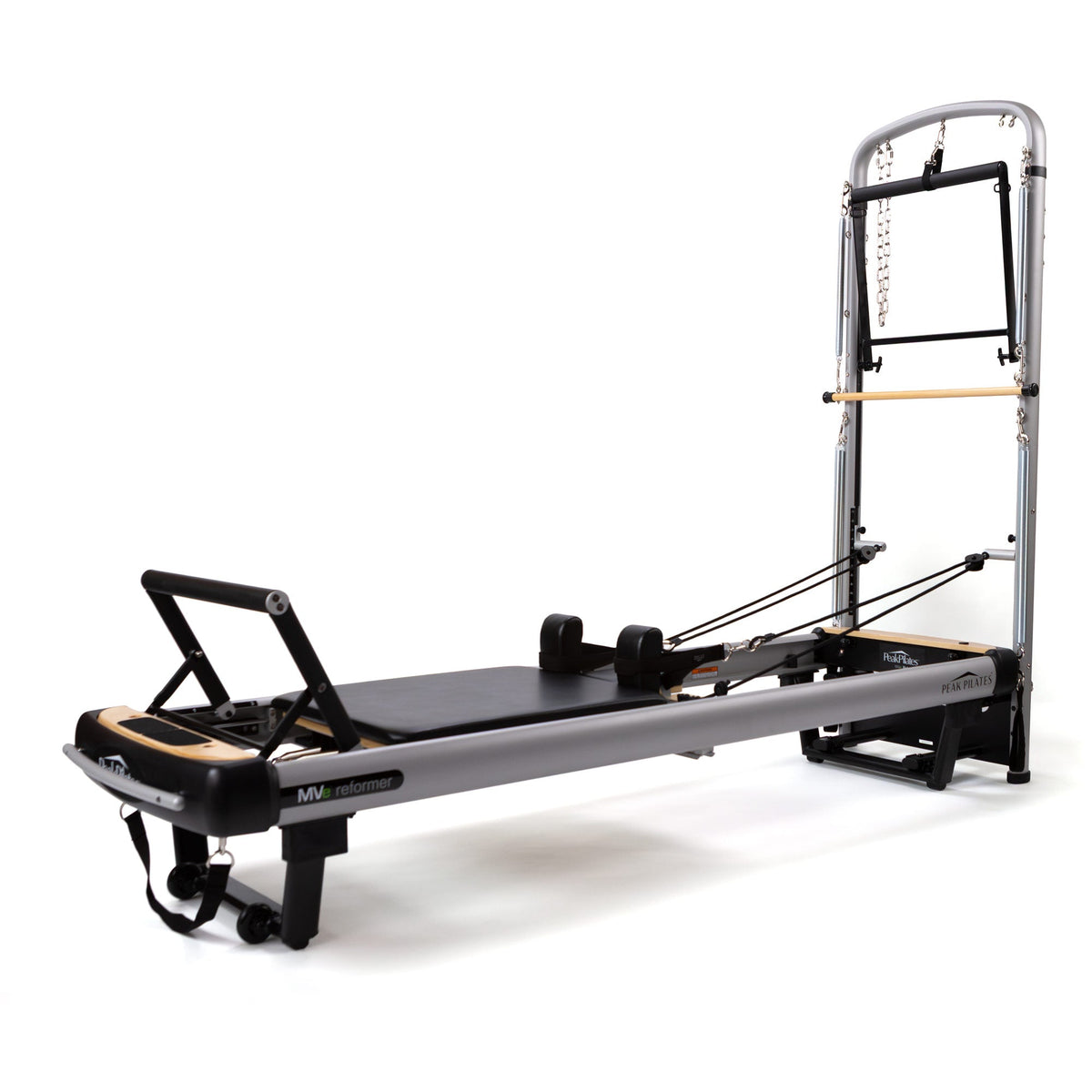 MVe Reformer with retractable shoulder blocks, foam rollers, black straps, and attached tower unit