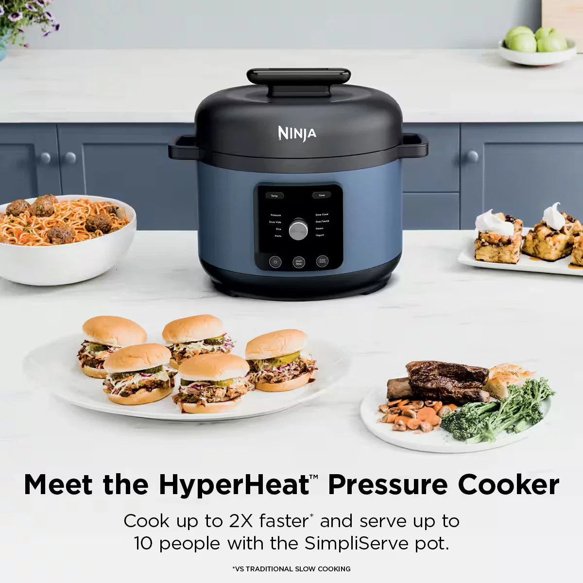 Blue Ninja multi cooker on marble counter surrounded by prepared dishes like spaghetti and pulled pork sliders