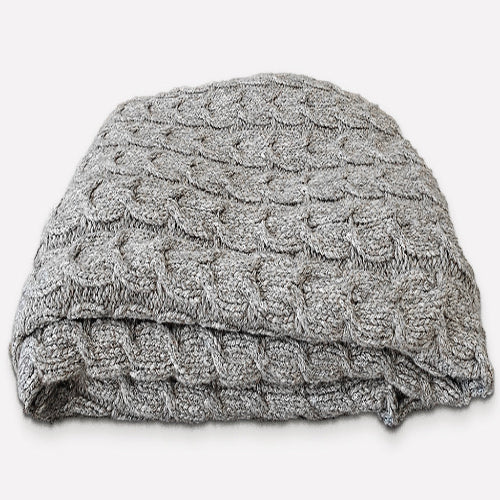 Folded graphite gray alpaca cotton blanket showing braided texture
