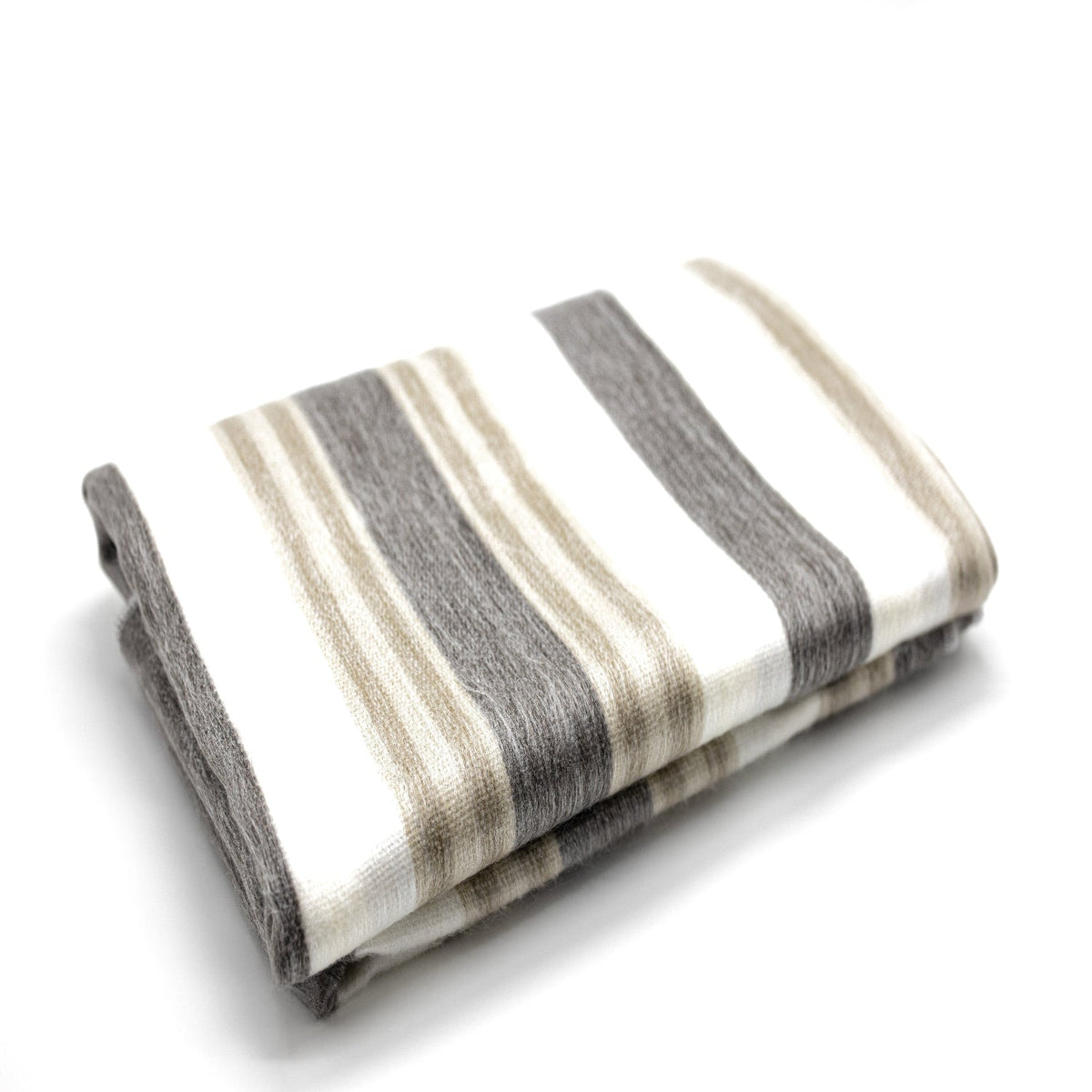 Plush cream camel alpaca throw folded with hand-sewn edges