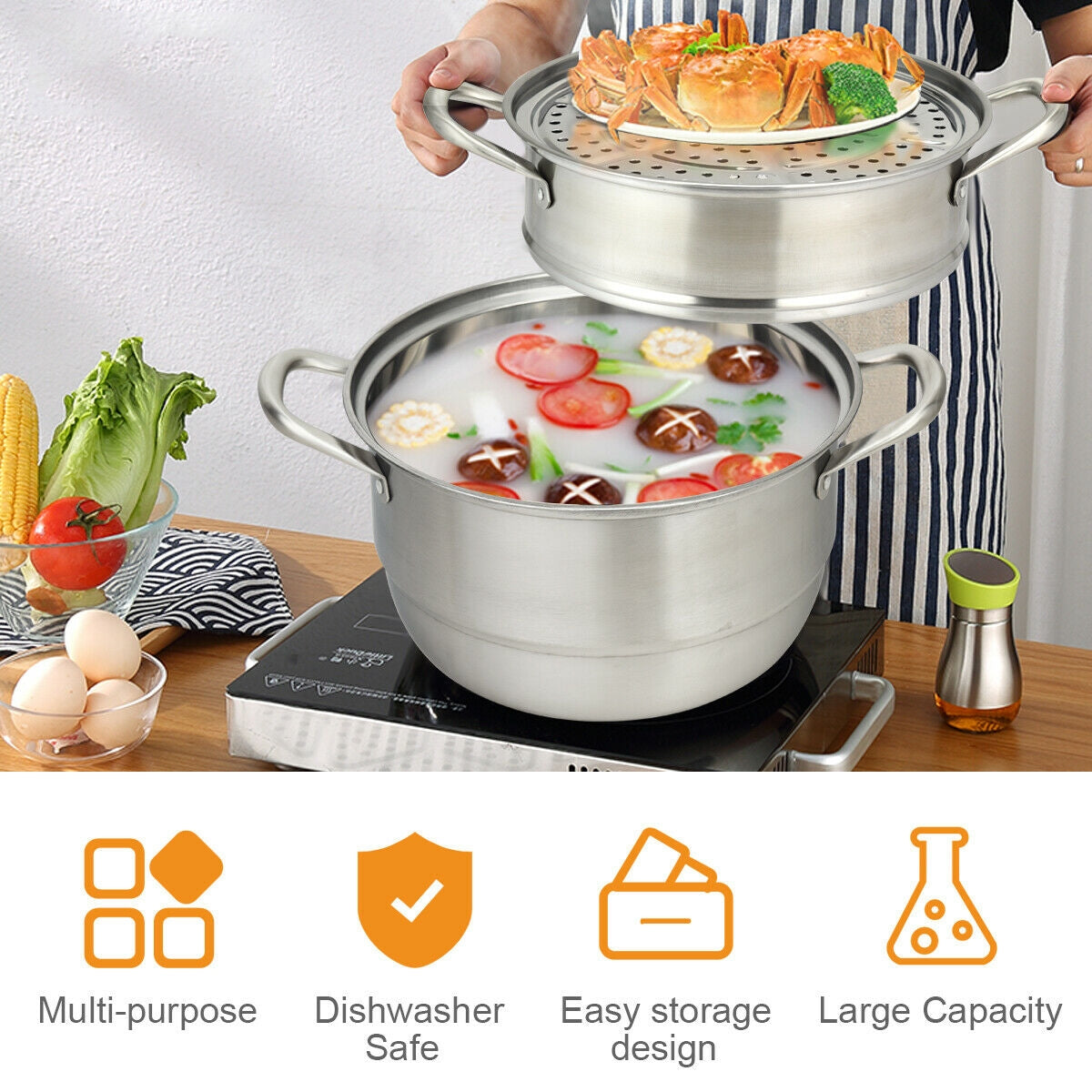 Person removing perforated insert from 3 tier stainless steel steamer pot containing broth and vegetables on portable stove