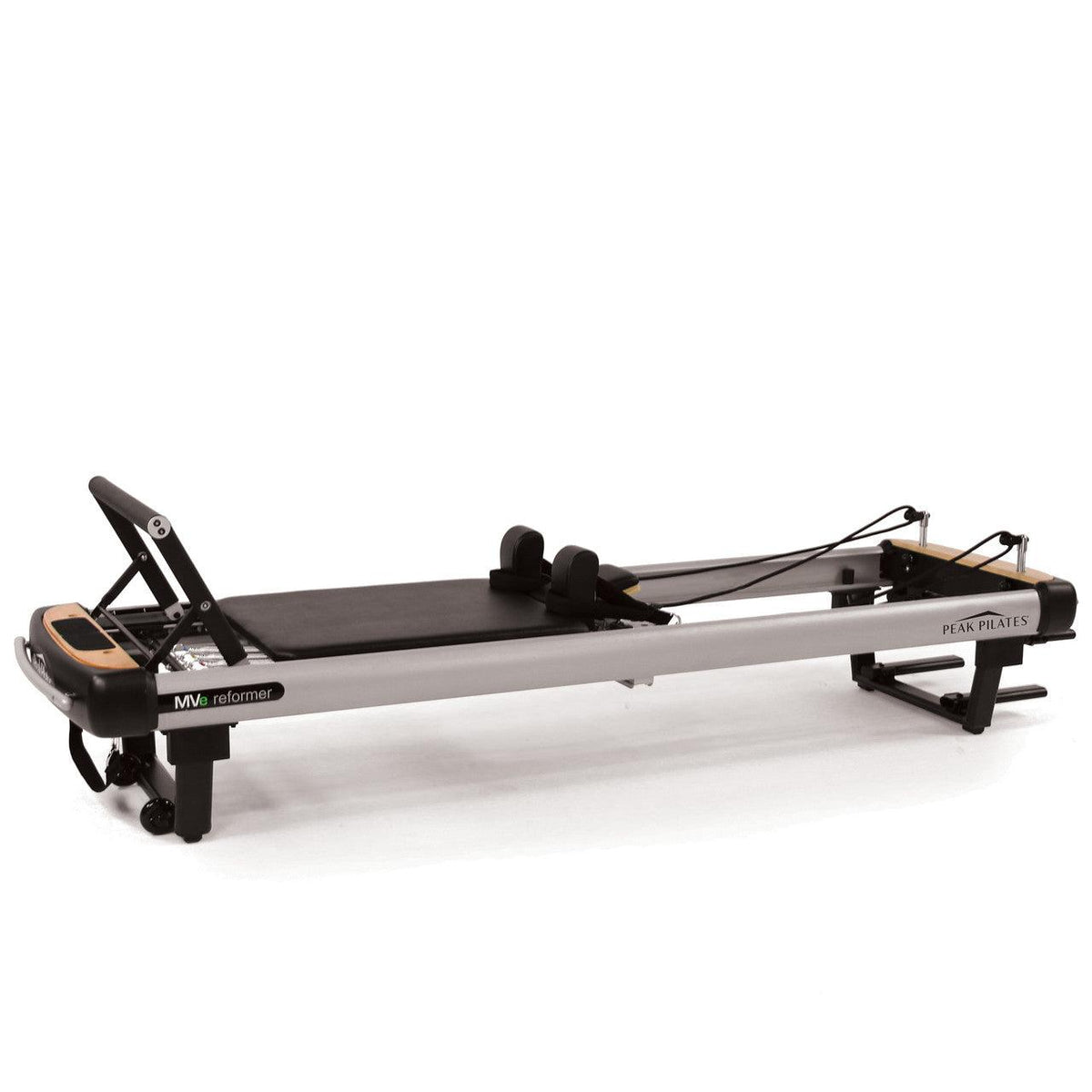 Silver precision aluminum frame MVe Reformer with black upholstery, retractable shoulder blocks, and branding