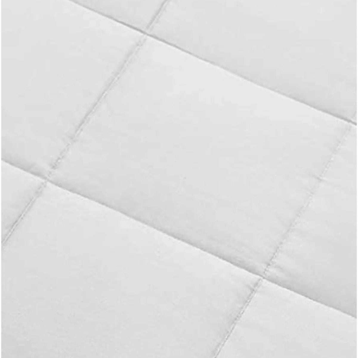 Angled close-up of uniform grid quilting design on a white comforter surface, holding breathable filling in place for