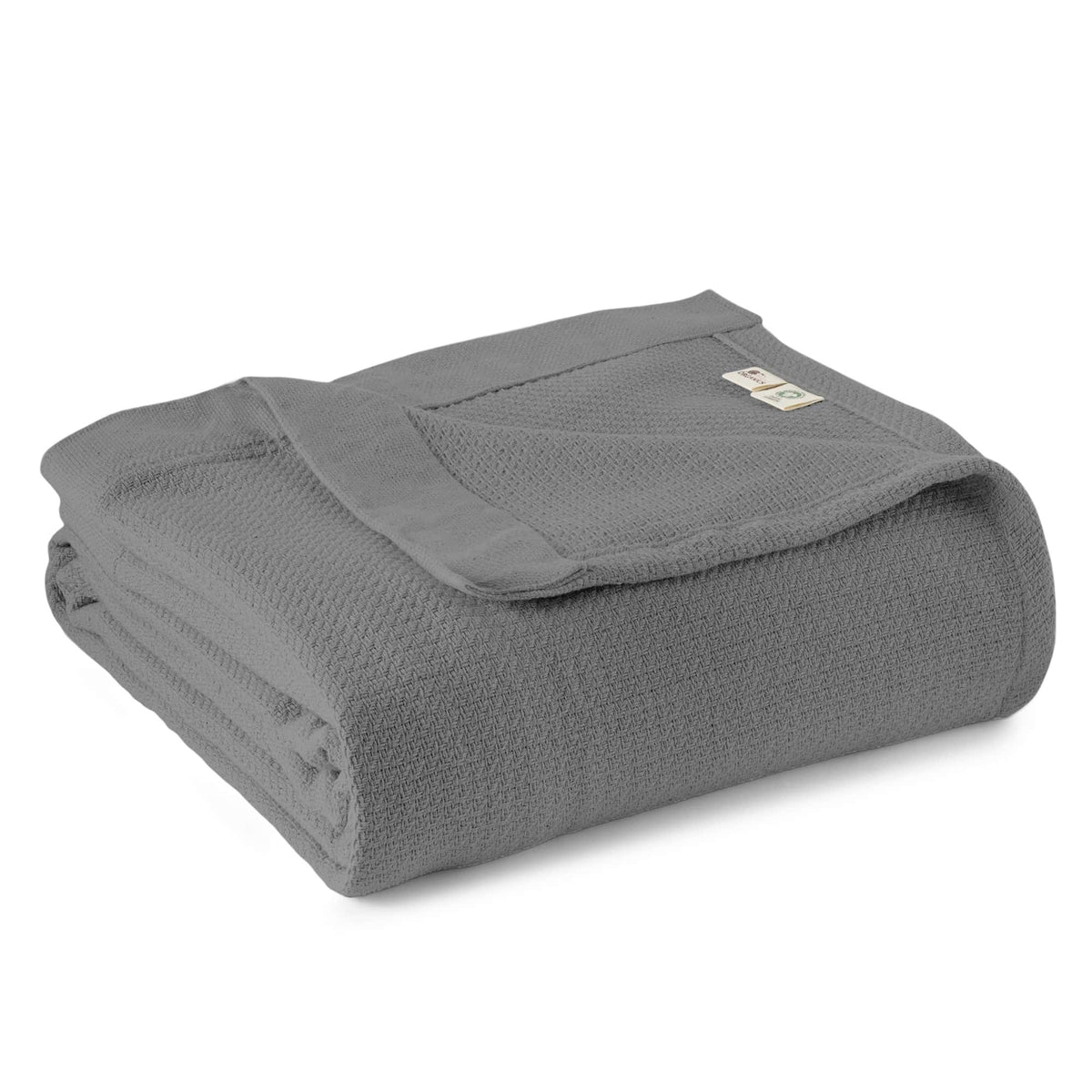 Medium charcoal grey woven blanket in neat fold showing textured surface and logo tag on white background