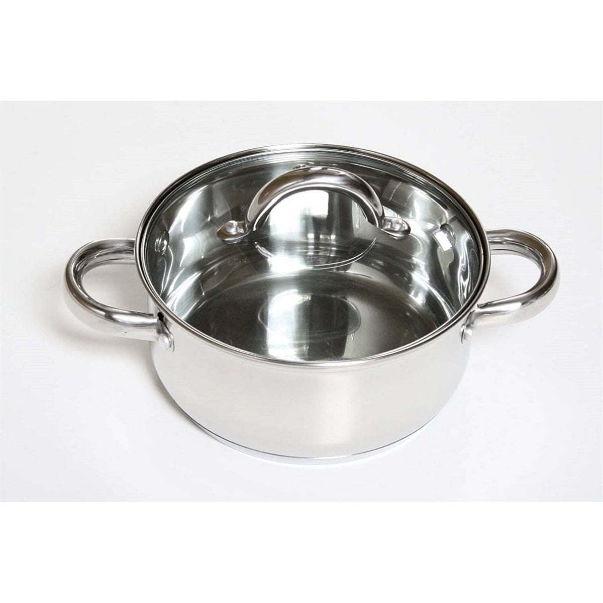 Stainless steel stockpot with dual side handles and clear tempered glass lid on white backdrop