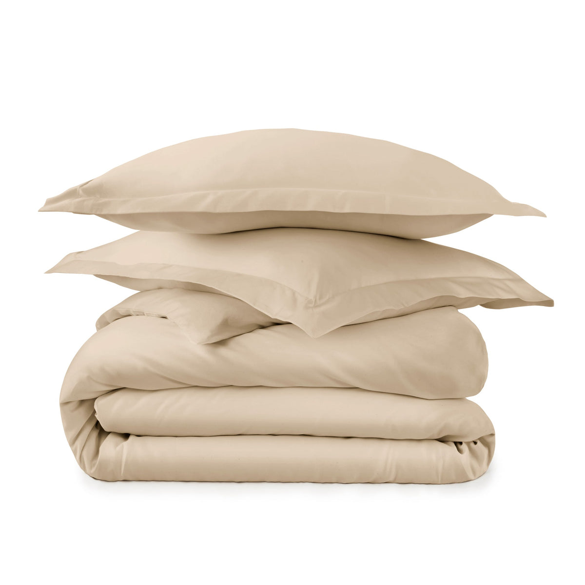 Warm beige tan bedding stack displaying smooth organic cotton fabric and elegant flange edges
