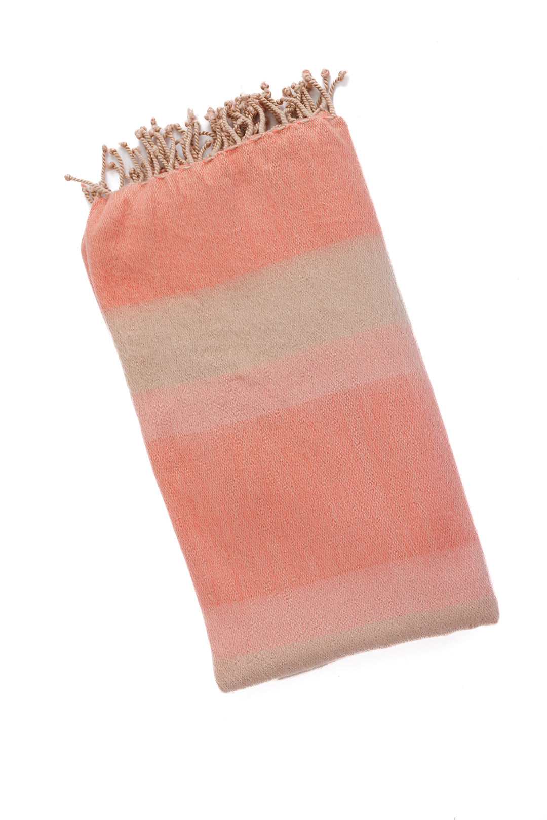 Folded coral and neutral striped alpaca throw angled diagonally highlighting soft woven texture and braided fringe edge