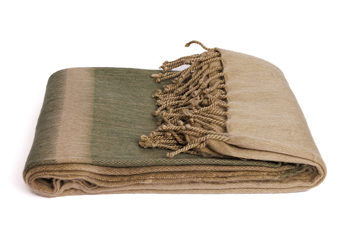 Close up of woven alpaca fiber texture with khaki sections and olive green stripes and hand-tied fringe