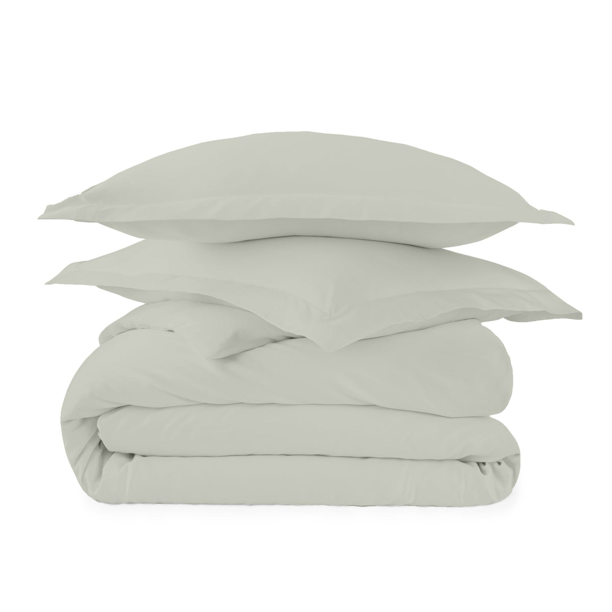 Sage green bedding set stacked with two shams on folded duvet cover against clean white background