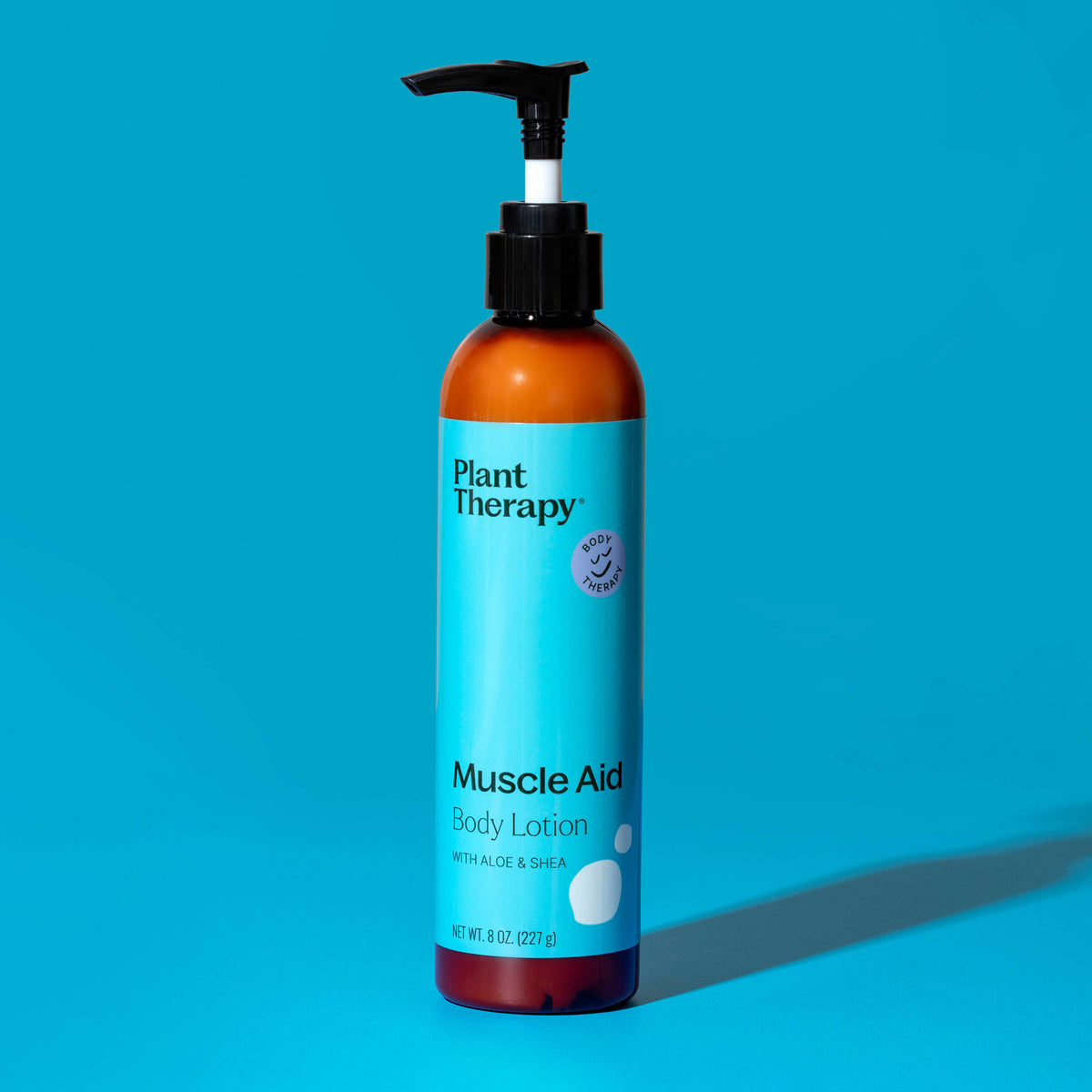 Front view of upright Plant Therapy lotion bottle showing brand logo and 8 oz size