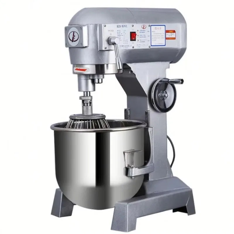 Silver industrial dough mixer with stainless steel bowl and wire whisk attachment