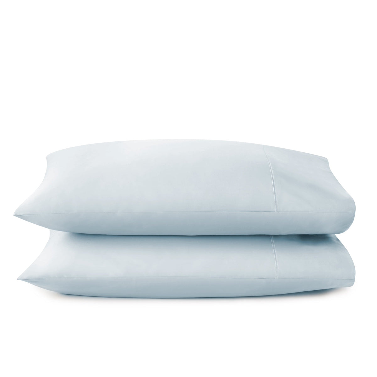 Light blue sateen pillowcases stacked neatly showcasing soft lustrous finish and envelope design