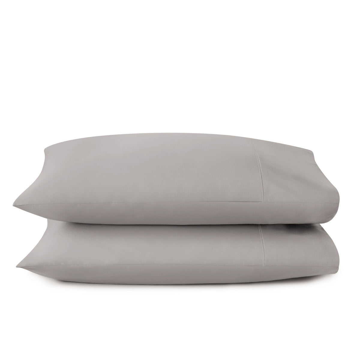 Muted taupe grey sateen pillowcases stacked horizontally displaying minimalist design and texture