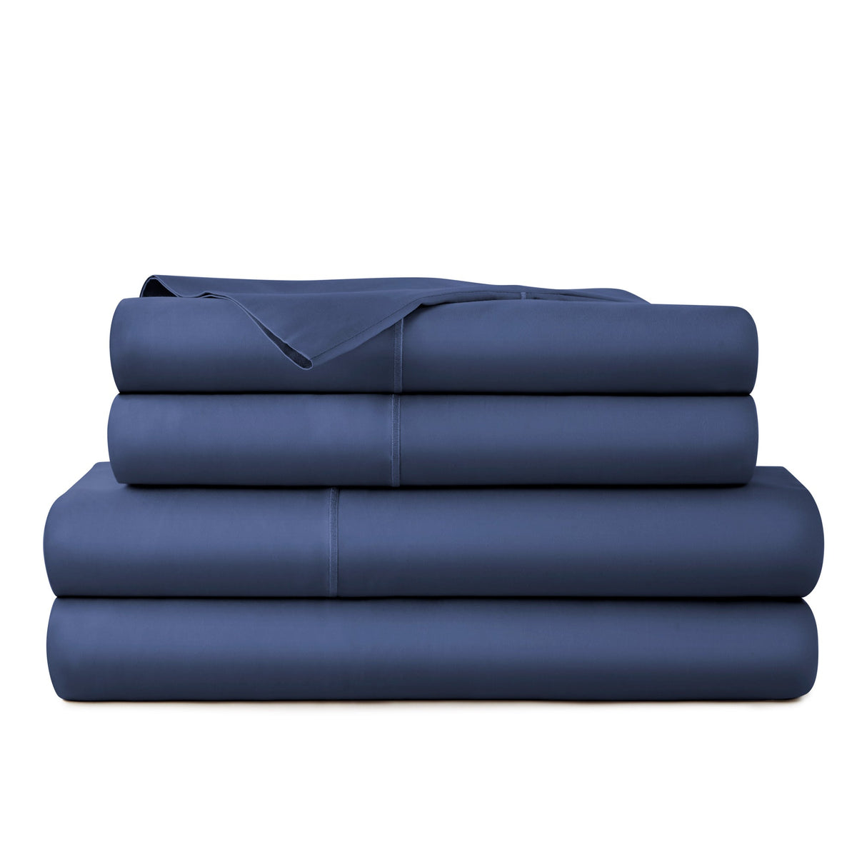 Stacked arrangement of deep navy blue organic cotton sheets showcasing soft sateen finish and minimalist presentation
