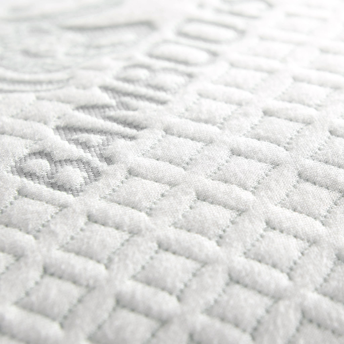 Textured white raised diamond-quilted pattern on soft bamboo viscose material