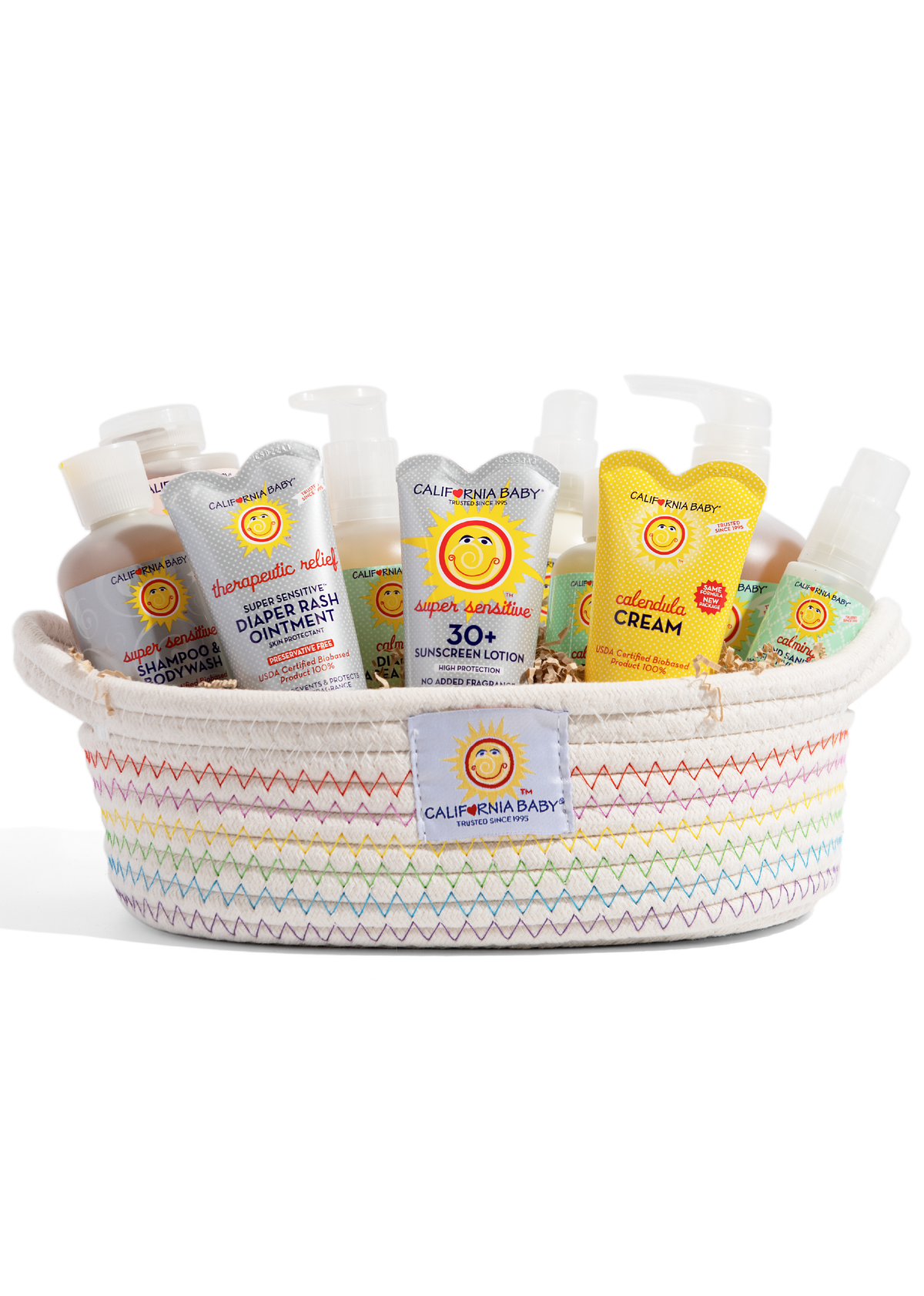 White woven gift basket with rainbow zigzag stitching and California Baby patch filled with baby care products