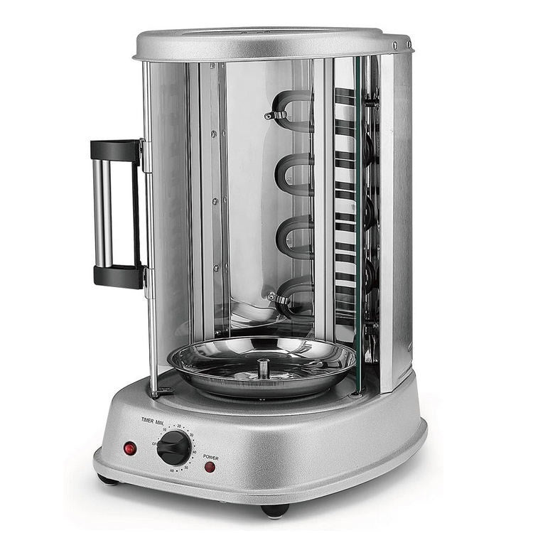 Silver electric rotisserie with cylindrical glass chamber revealing internal heating elements and drip pan, featuring side