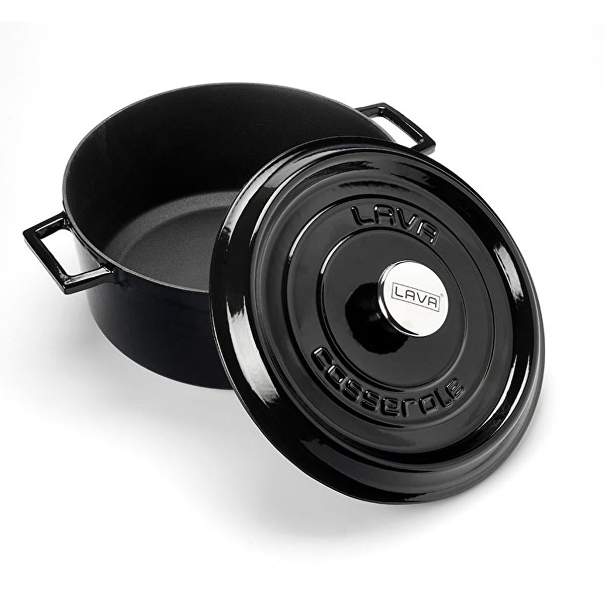 Angled shot of open black enamel cookware vessel with branded lid resting beside it to show depth