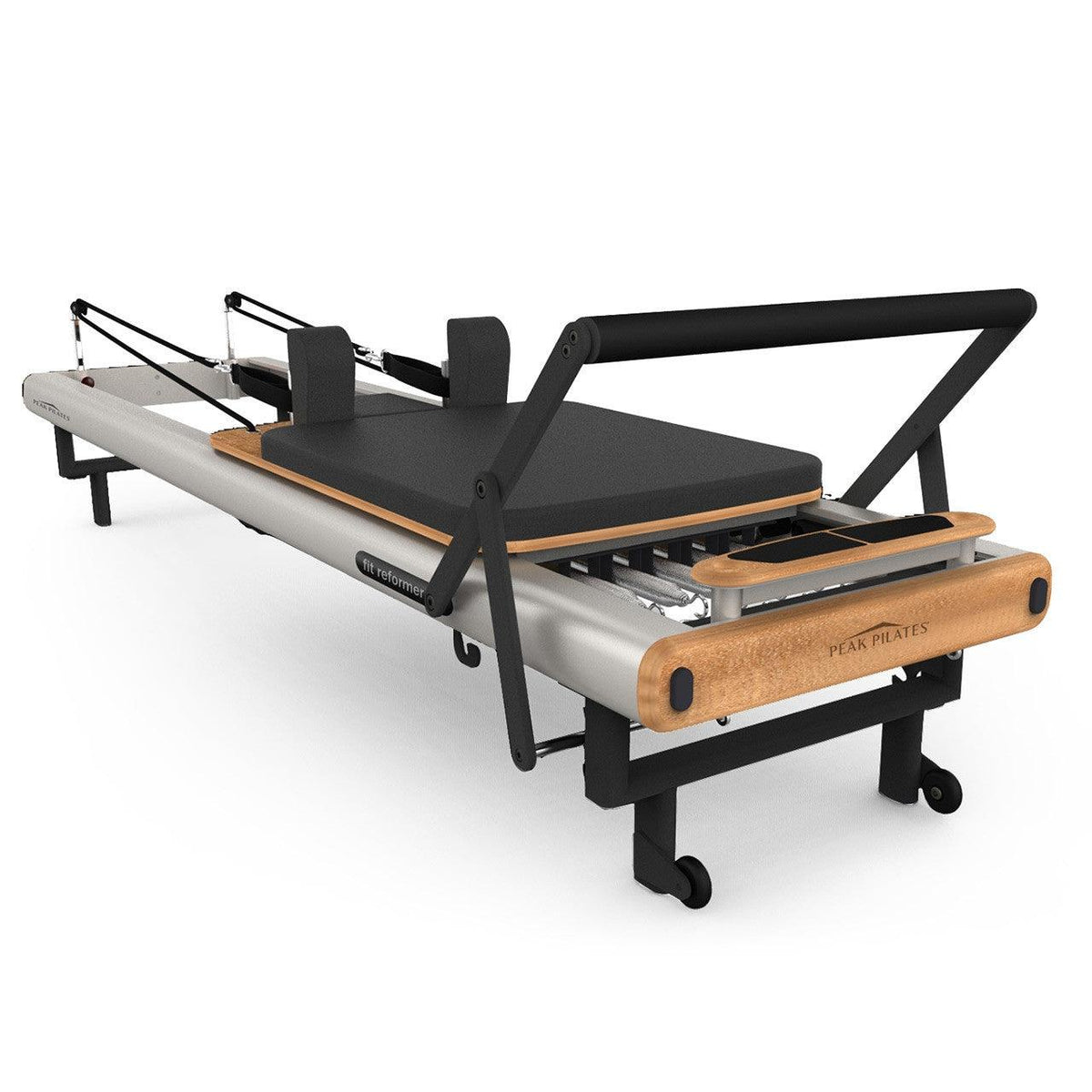 High-angle view of grey and beechwood fit Reformer highlighting natural wood grain, black padded seat, shoulder rests, and