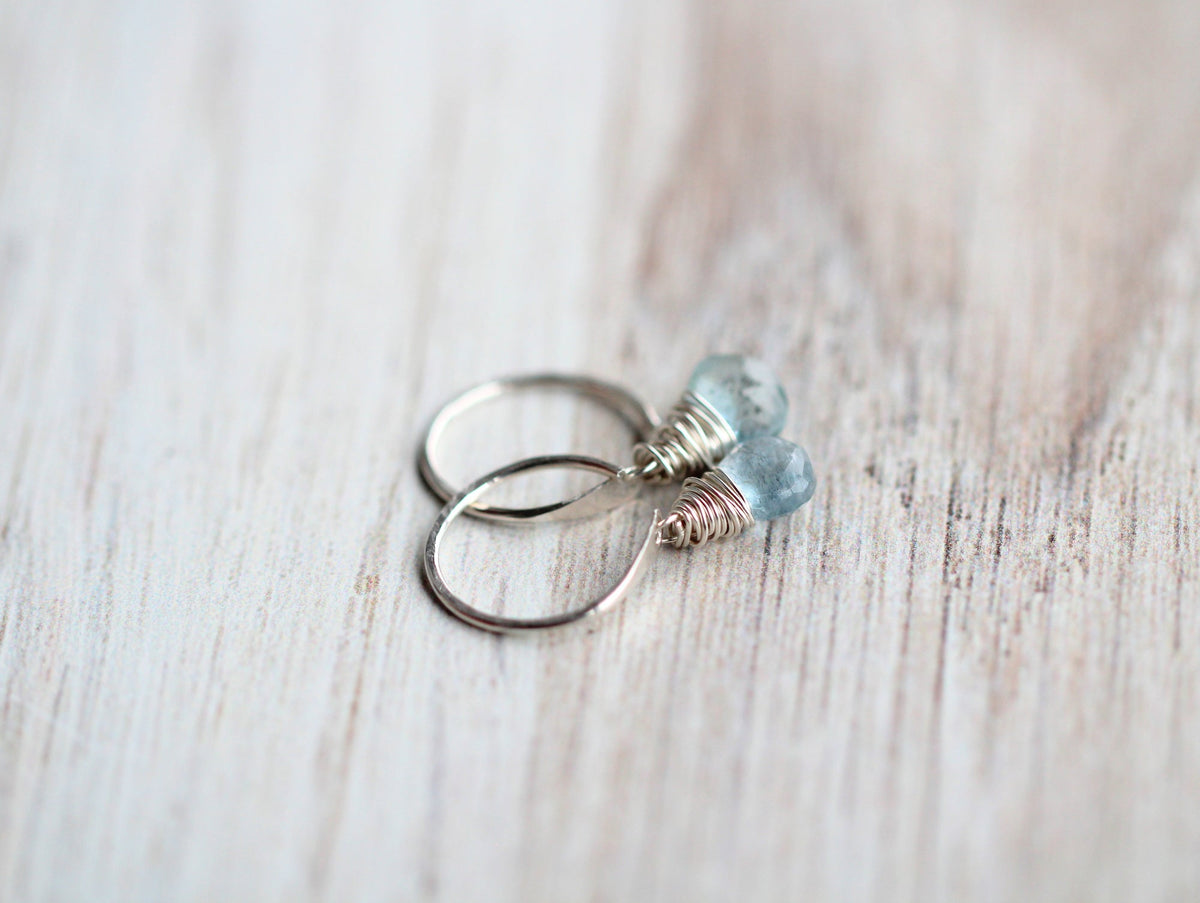 Sterling silver huggies with wire-wrapped light blue moss aquamarine beads